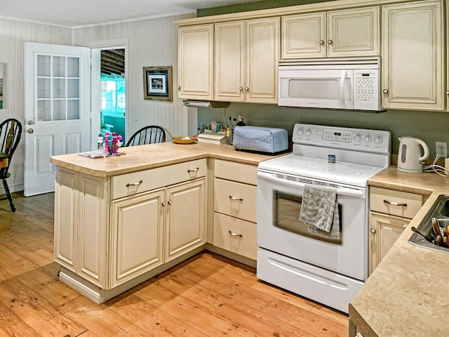 121 Platt Rd, Highgate, VT 05459 - kitchen with white appliances, a peninsula, light countertops, light wood-type flooring, and ornamental molding