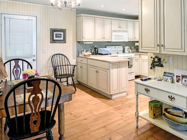 121 Platt Rd, Highgate, VT 05459 - kitchen featuring white appliances, light countertops, light wood-style floors, a chandelier, and decorative light fixtures