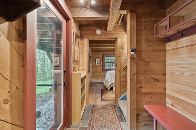 bathroom featuring wood walls, wood ceiling, and beam ceiling