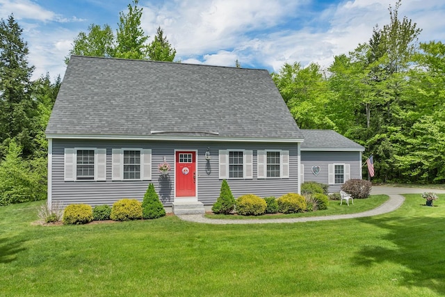cape cod home with a front lawn and a shingled roof