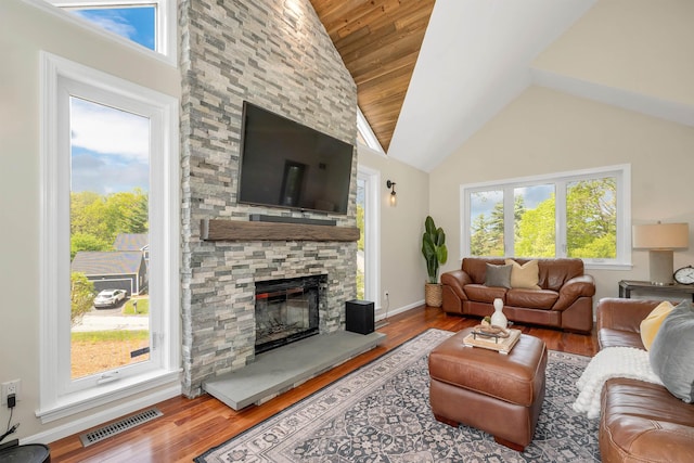204 Chase Way, Manchester, NH 03104 - living room with plenty of natural light, wood finished floors, high vaulted ceiling, a fireplace, and baseboards