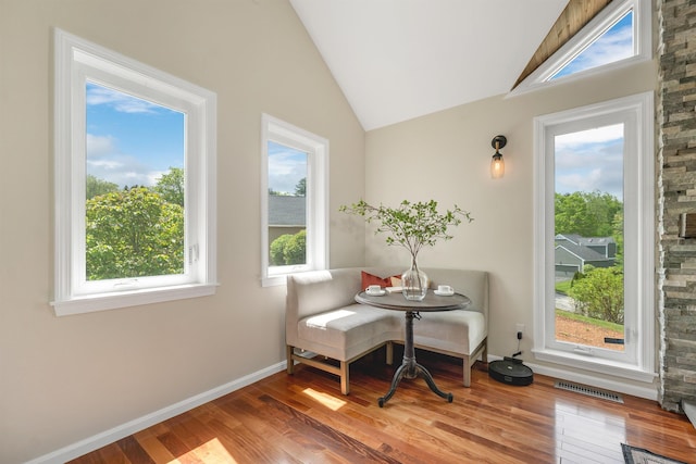 204 Chase Way, Manchester, NH 03104 - dining space featuring vaulted ceiling, wood finished floors, and baseboards