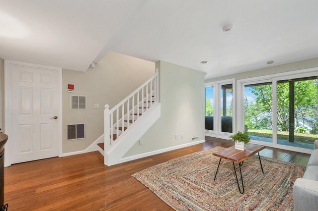 204 Chase Way, Manchester, NH 03104 - living room with stairway, wood finished floors, and baseboards