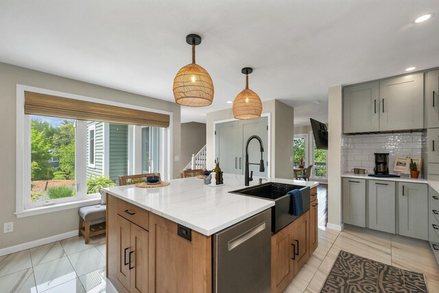 204 Chase Way, Manchester, NH 03104 - kitchen featuring a sink, baseboards, dishwasher, decorative backsplash, and pendant lighting