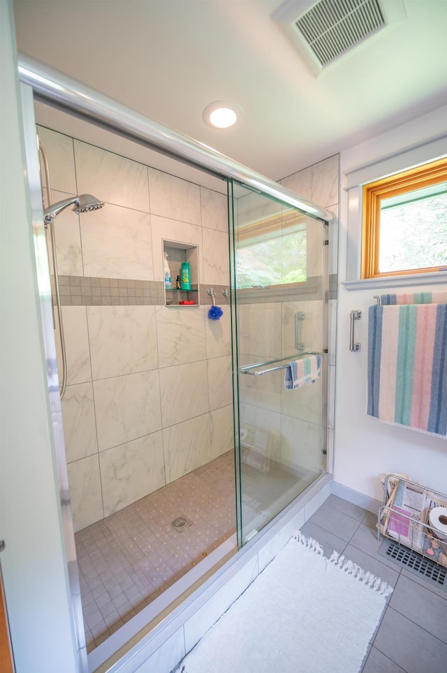 bathroom with tile patterned flooring, a shower stall, and recessed lighting