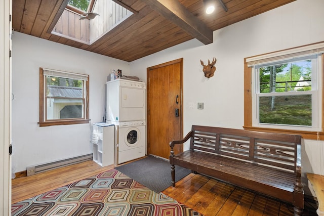 46 Crestwood Dr, Conway, NH 03860 - foyer with stacked washer / dryer, baseboard heating, a skylight, hardwood / wood-style floors, and healthy amount of natural light