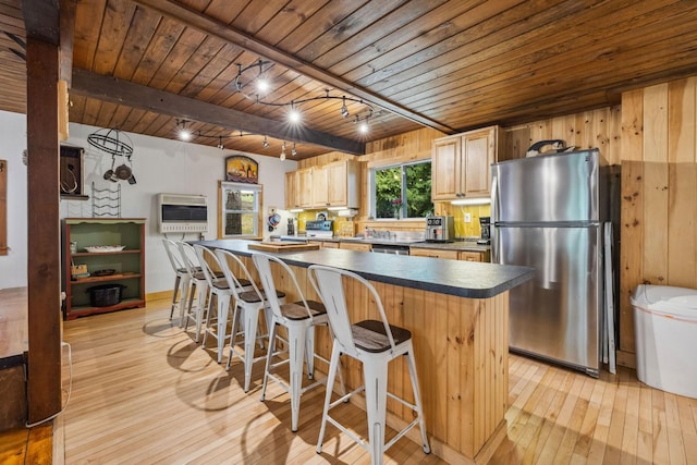 46 Crestwood Dr, Conway, NH 03860 - kitchen with stainless steel appliances, wooden ceiling, light wood-type flooring, heating unit, and dark countertops