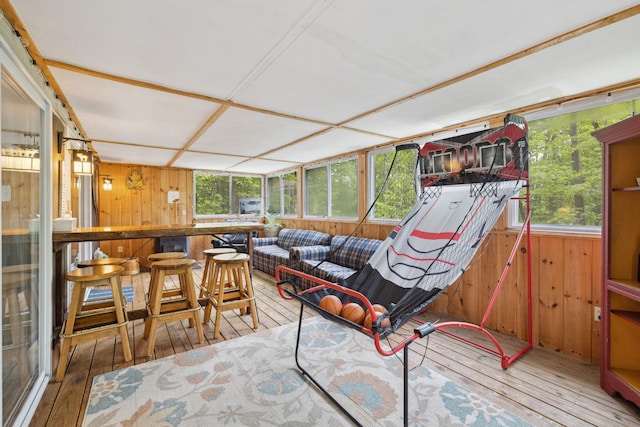 46 Crestwood Dr, Conway, NH 03860 - sunroom with wood walls, hardwood / wood-style flooring, and a wooden deck