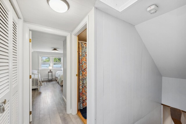 46 Crestwood Dr, Conway, NH 03860 - hall with light wood-type flooring, a skylight, and baseboard heating