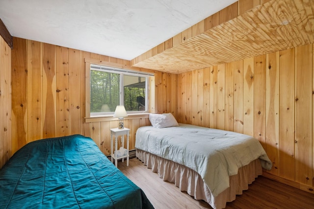 46 Crestwood Dr, Conway, NH 03860 - bedroom featuring wood finished floors and wooden walls