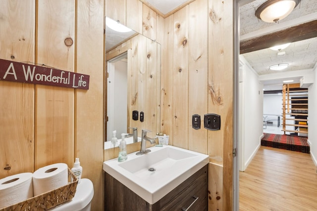 46 Crestwood Dr, Conway, NH 03860 - bathroom featuring wood finished floors, vanity, toilet, baseboards, and wood walls