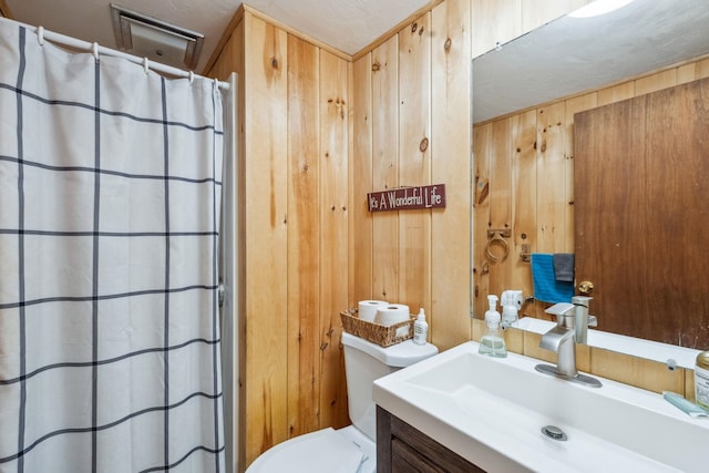 46 Crestwood Dr, Conway, NH 03860 - full bathroom featuring wood walls, toilet, vanity, and a shower with shower curtain