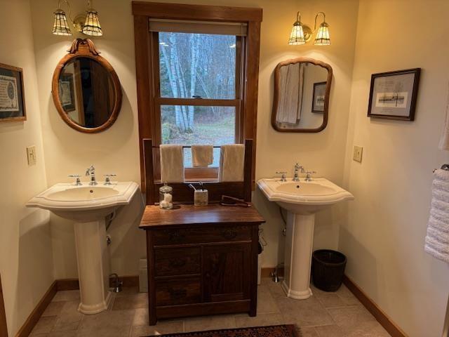 133 Ben Dexter Rd, Topsham, VT 05076 - bathroom with tile patterned floors, baseboards, and ornate columns