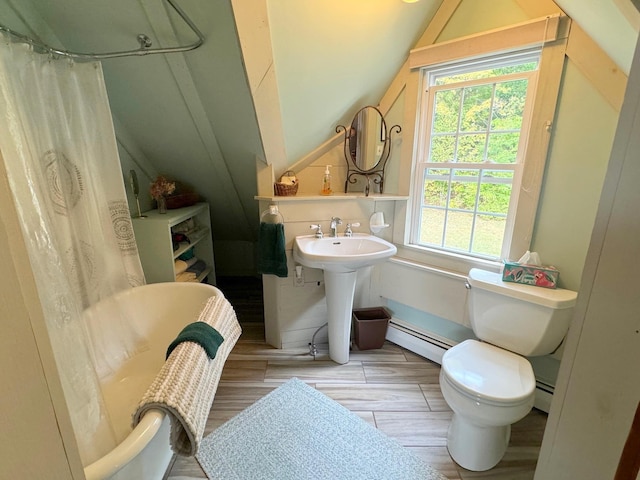 133 Ben Dexter Rd, Topsham, VT 05076 - full bathroom featuring baseboard heating, lofted ceiling, toilet, wood finished floors, and a shower with curtain