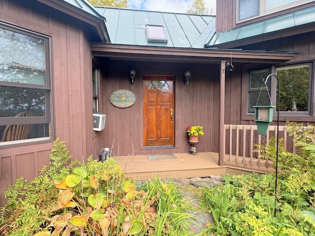 133 Ben Dexter Rd, Topsham, VT 05076 - property entrance with metal roof, a porch, and a standing seam roof