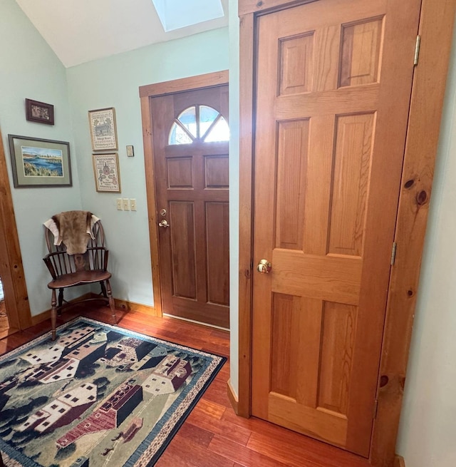 133 Ben Dexter Rd, Topsham, VT 05076 - foyer entrance with a skylight, light wood-style flooring, lofted ceiling, and baseboards