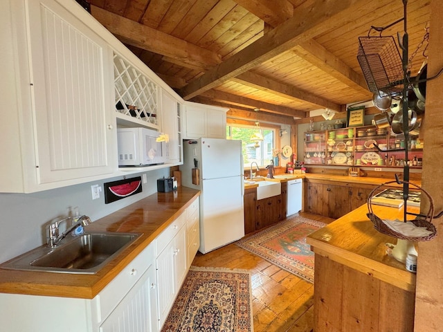133 Ben Dexter Rd, Topsham, VT 05076 - kitchen featuring white appliances, a sink, light wood-style flooring, wood ceiling, and beam ceiling