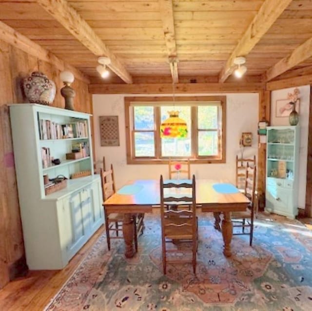 133 Ben Dexter Rd, Topsham, VT 05076 - dining space featuring wooden ceiling, beamed ceiling, and wood finished floors