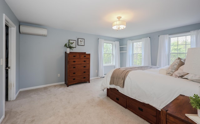 126 Oakcrest Ln, Gilmanton, NH 03237 - bedroom featuring an AC wall unit, light colored carpet, and baseboards