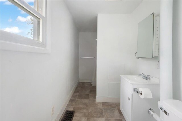 16 Shurtleff Pl, Barre City, VT 05641 - bathroom featuring vanity, toilet, and baseboards