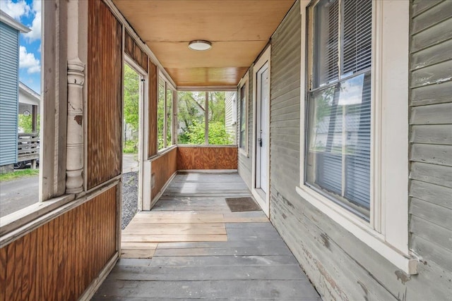 16 Shurtleff Pl, Barre City, VT 05641 - unfurnished sunroom with wood walls and wood-type flooring