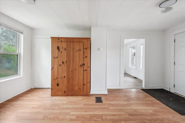 16 Shurtleff Pl, Barre City, VT 05641 - unfurnished bedroom featuring multiple windows and light wood-style floors