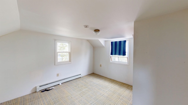 17 Convent Sq, Burlington, VT 05401 - additional living space featuring a baseboard radiator, vaulted ceiling, and light carpet