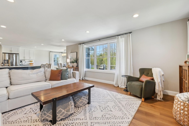 222 Standish Ln, Hudson, NH 03051 - living room with recessed lighting, light wood-style flooring, and baseboards