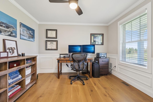 222 Standish Ln, Hudson, NH 03051 - home office with crown molding, a ceiling fan, light wood-type flooring, wainscoting, and a decorative wall