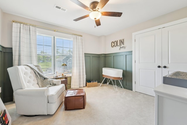 222 Standish Ln, Hudson, NH 03051 - sitting room with a decorative wall, ceiling fan, carpet floors, and a wainscoted wall
