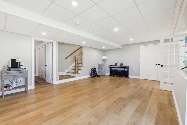 222 Standish Ln, Hudson, NH 03051 - living area with stairway, light wood-type flooring, baseboards, recessed lighting, and a paneled ceiling