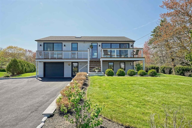 797 Ocean Blvd, Rye, NH 03870 - view of front facade with a front lawn, driveway, and a garage