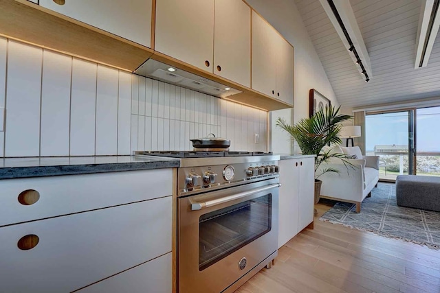 797 Ocean Blvd, Rye, NH 03870 - kitchen featuring high end stainless steel range, light wood-style flooring, under cabinet range hood, open floor plan, and beam ceiling