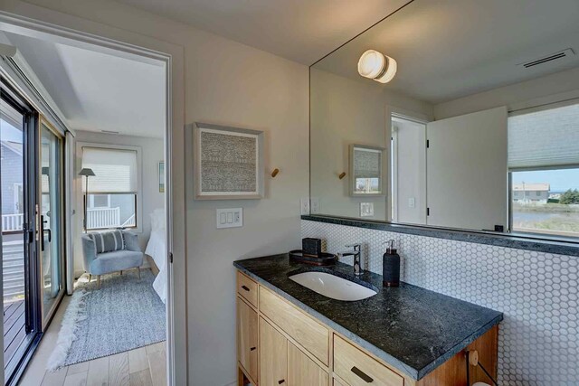 797 Ocean Blvd, Rye, NH 03870 - bathroom with healthy amount of natural light, wood finished floors, and vanity