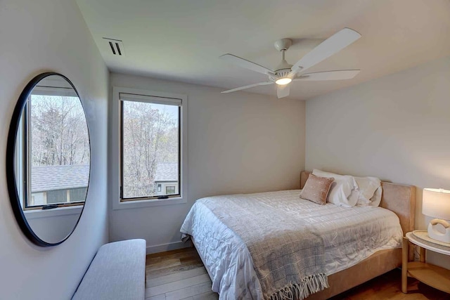 797 Ocean Blvd, Rye, NH 03870 - bedroom featuring wood finished floors, ceiling fan, and baseboards