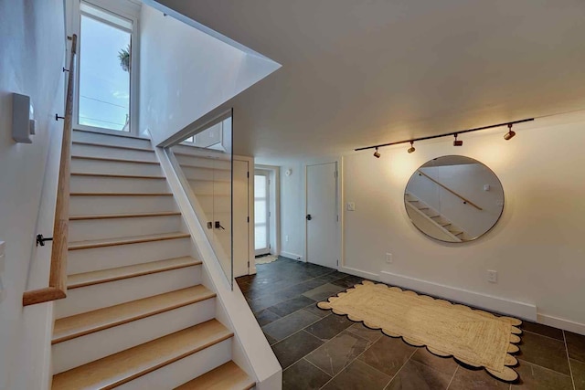 797 Ocean Blvd, Rye, NH 03870 - entryway with stairs, plenty of natural light, track lighting, and baseboards