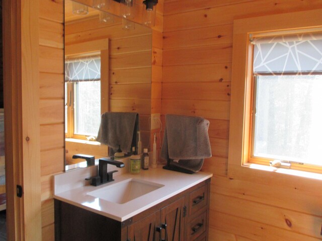 42 Chickadee Ln, Littleton, NH 03561 - bathroom with wood walls and vanity