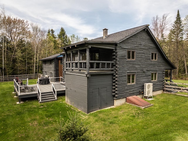 42 Chickadee Ln, Littleton, NH 03561 - back of house featuring log exterior, a chimney, a yard, and a deck