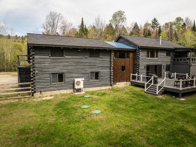 42 Chickadee Ln, Littleton, NH 03561 - rear view of house featuring log exterior, a wooden deck, a yard, and roof with shingles