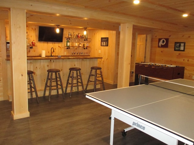 42 Chickadee Ln, Littleton, NH 03561 - playroom with wood walls, bar with sink, wood ceiling, wood finished floors, and baseboards