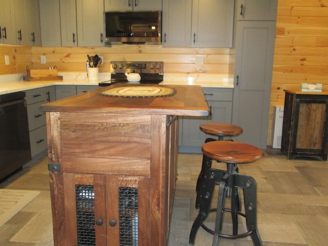 42 Chickadee Ln, Littleton, NH 03561 - kitchen with stainless steel appliances, light countertops, and gray cabinets