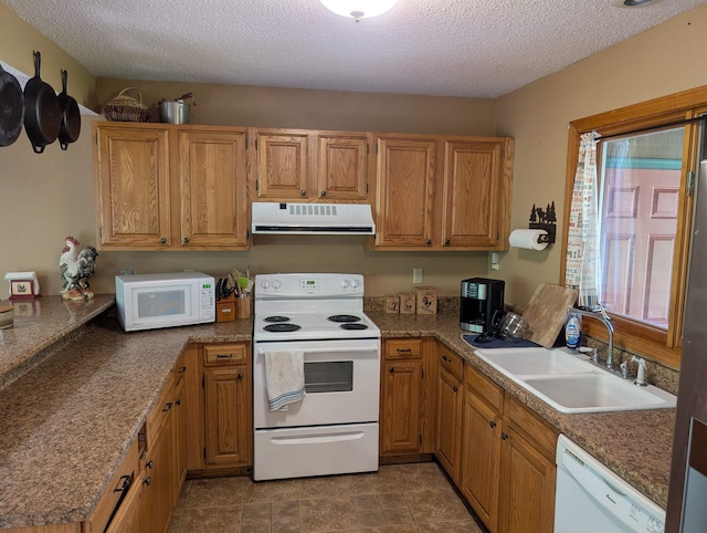 11 Cascade Dr Unit 288, Woodstock, NH 03262 - kitchen with ventilation hood, white appliances, a sink, a textured ceiling, and brown cabinets