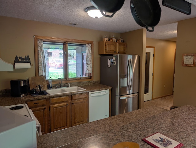 11 Cascade Dr Unit 288, Woodstock, NH 03262 - kitchen featuring white dishwasher, stainless steel fridge with ice dispenser, a sink, brown cabinets, and a textured ceiling