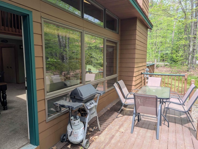 11 Cascade Dr Unit 288, Woodstock, NH 03262 - deck featuring outdoor dining area, a forest view, and area for grilling