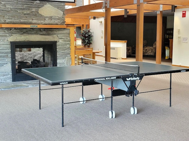 11 Cascade Dr Unit 288, Woodstock, NH 03262 - recreation room with an outdoor stone fireplace and carpet floors