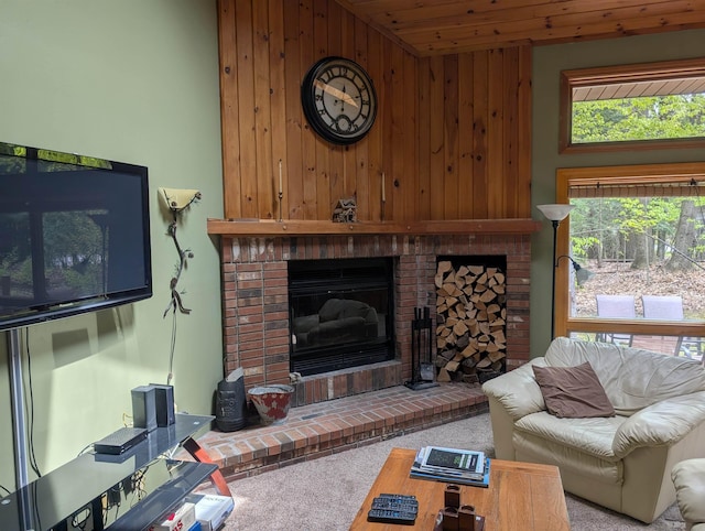 11 Cascade Dr Unit 288, Woodstock, NH 03262 - carpeted living room featuring wooden walls and a fireplace