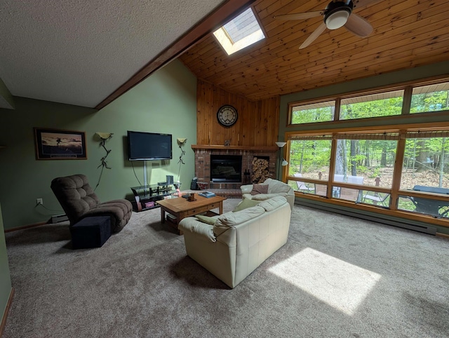 11 Cascade Dr Unit 288, Woodstock, NH 03262 - carpeted living room featuring ceiling fan, lofted ceiling, a skylight, a fireplace, and wooden walls