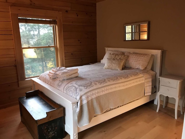 42 Peak Vista Ln, Madison, NH 03849 - bedroom with wood finished floors and wooden walls