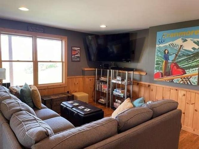 42 Peak Vista Ln, Madison, NH 03849 - living room with wainscoting, wooden walls, wood finished floors, and recessed lighting