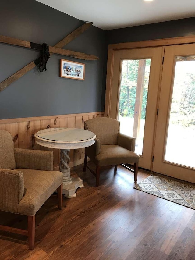 42 Peak Vista Ln, Madison, NH 03849 - living area featuring wainscoting, wood finished floors, and wooden walls